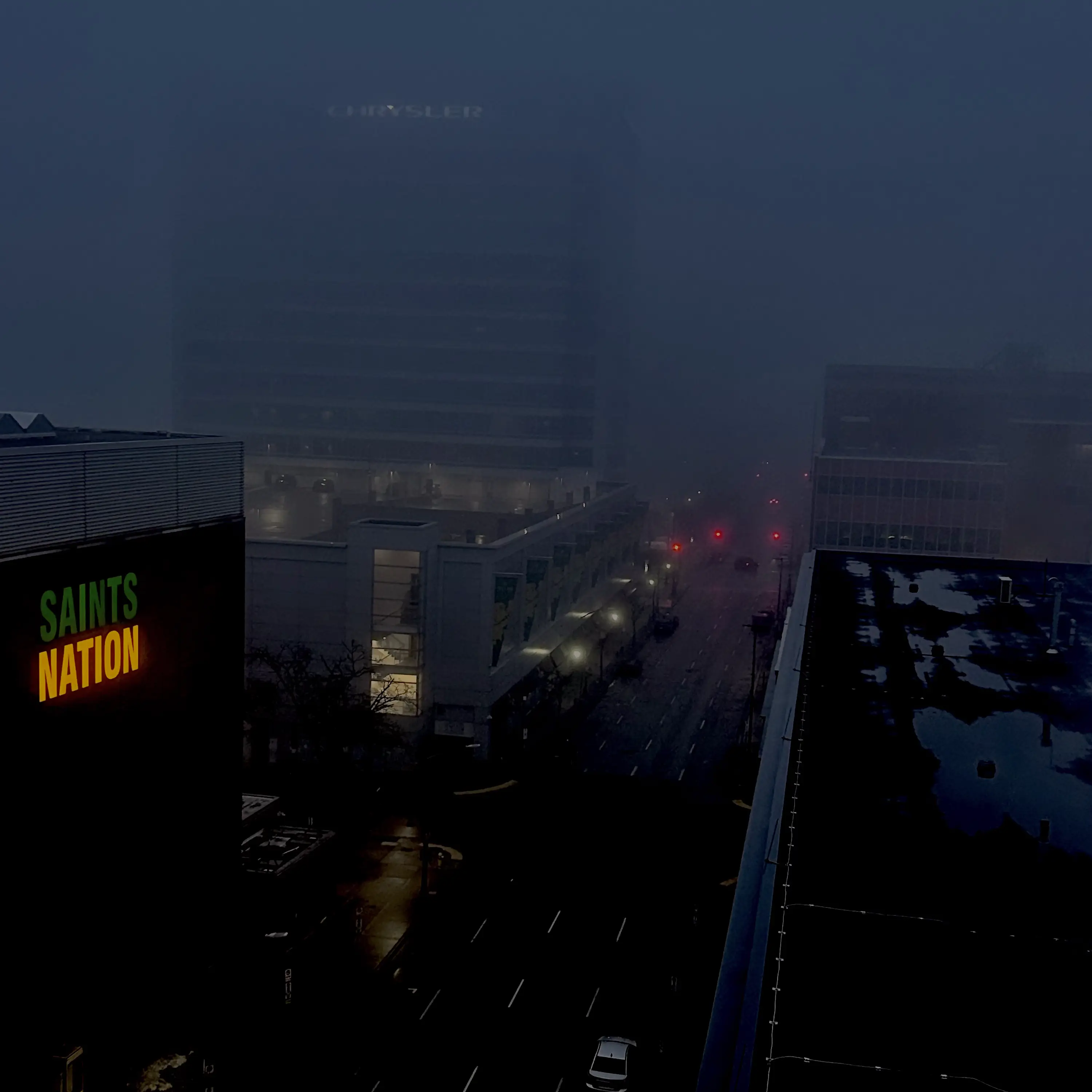 image of a city with a green and yellow saints nation sign